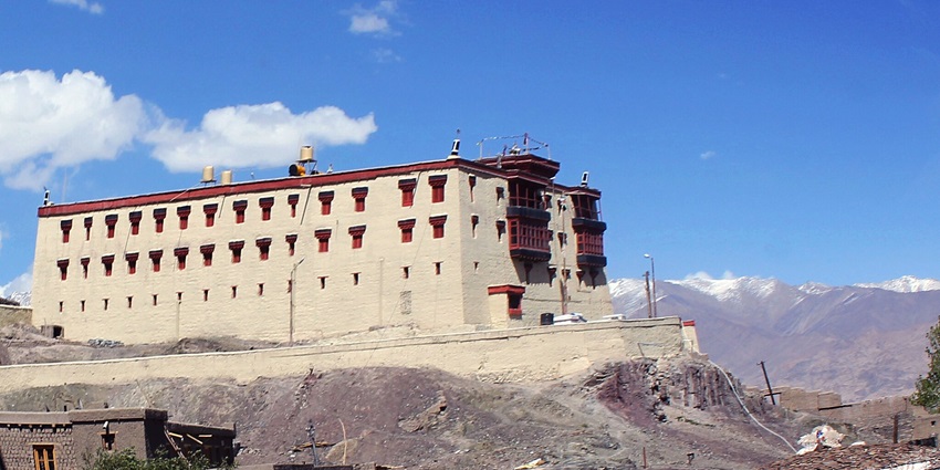 Stok Palace in Ladakh, featuring stunning architecture against a mountainous backdrop.