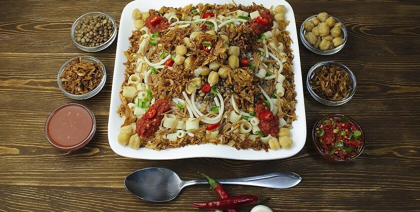 Snapshot of the Koshary on a ceramic plate served on the table of a restaurant