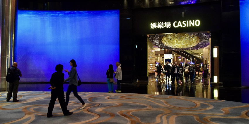 A vibrant shot of Studio City, a modern casino in Macau where people go for enjoyment.