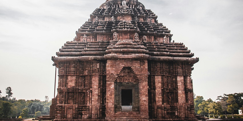 The façade of an ancient Subramanya Swamy temple in Tamil Nadu adorned with decorations and carvings.