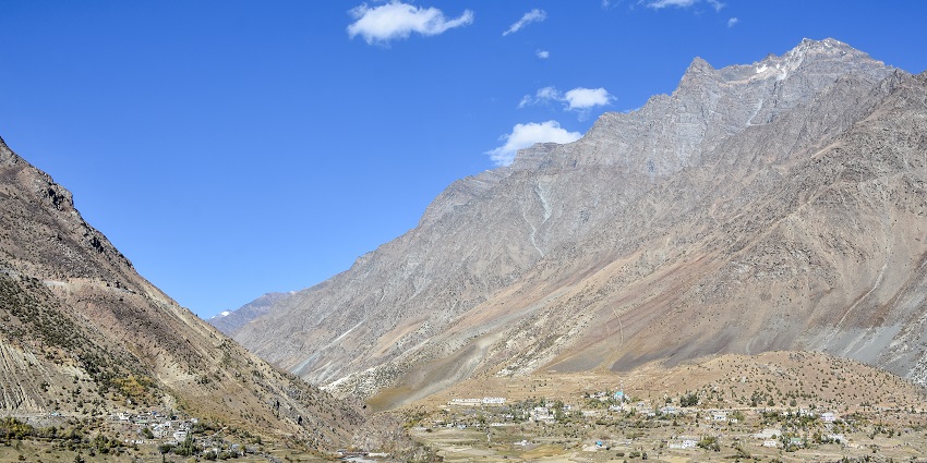 Picturesque view of of a village between the mountains covered with rocks during day time