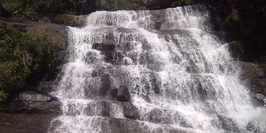 Chinna Suruli Waterfalls surrounded by dense forest - popular waterfall in Coimbatore.