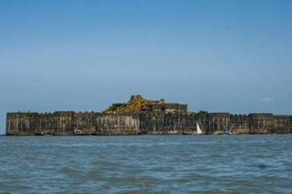 Panoramic view of the iconic Suvarnadurg Fort across the river body in Maharashtra