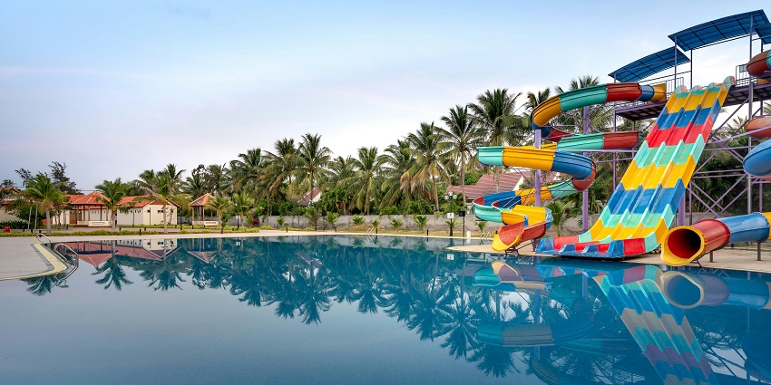A water ride area in the Taichamala Agrotourism And Adventure Park under blue skies.