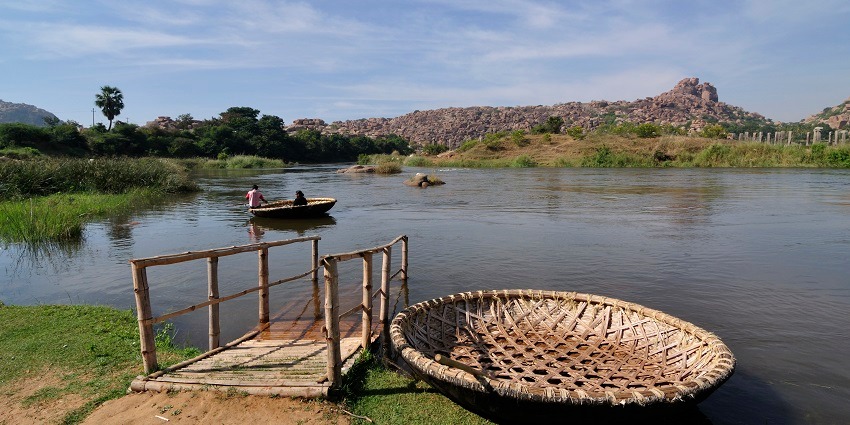 A traditional coracle boat ride on the Tungabhadra River, offering a different experience and one of the best things to do in Hampi.