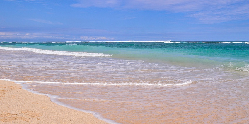 This is a picture of Pandawa Beach in Bali where all the five statues are located.