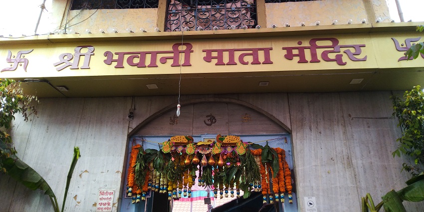 Ornate stone gate of Bhavani Mata Mandir in Pune, India, featuring intricate carvings