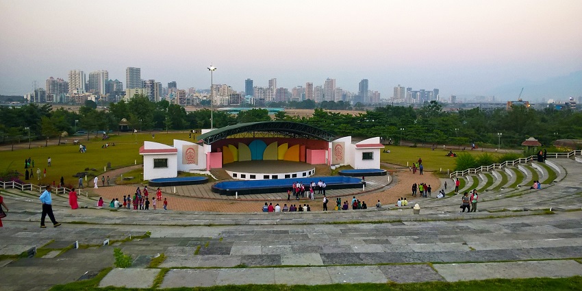 Spacious Central Park in Kharghar featuring lush green lawns, walking paths, and trees