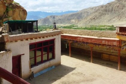 Panoramic view from roof of Thagthok Gompa showing courtyard and wall paintings-Takthok Monastery