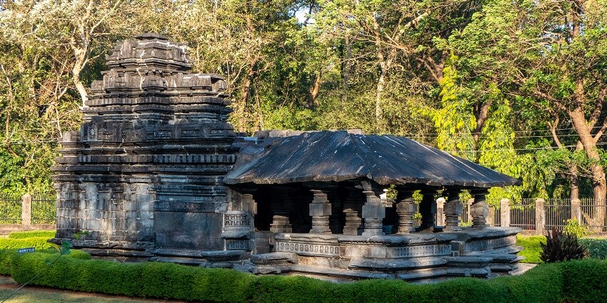 Tambdi Surla Temple near Surla Waterfalls features intricate basalt stone carvings.