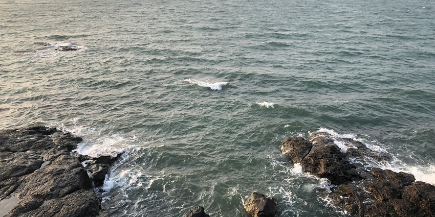 View of Tarkarli Beach, one of the famous beaches in Maharashtra, with clear waters.