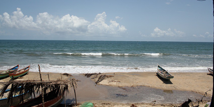 Aerial view of Tarkarli Beach along the white sand and blue crystal-clear water.