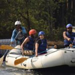 A picture of a group of friends doing rafting, one of the best Tarkarli water sports.