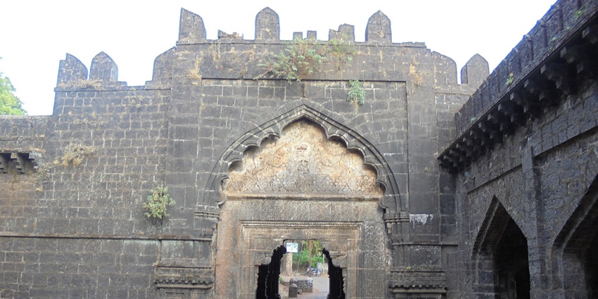 Majestic triple-arched gateway with historical significance
