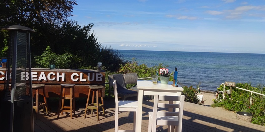 Upscale beach club with stylish lounge areas and ocean views.