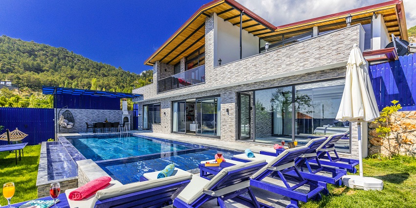 View of a charming property surrounded by beautiful gardens and a relaxing ambience.