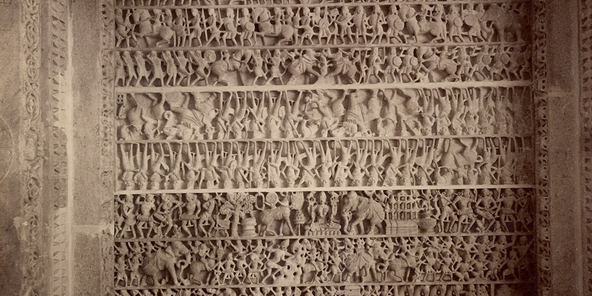 A view of the Dilwara Temple featuring multiple domes and detailed sculptures