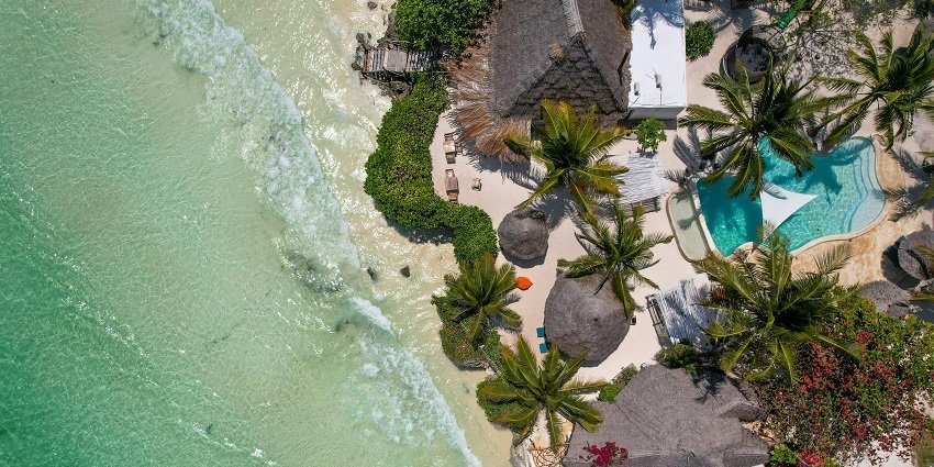 Stunning aerial view of a tropical resort near Mumbai surrounded by greenery