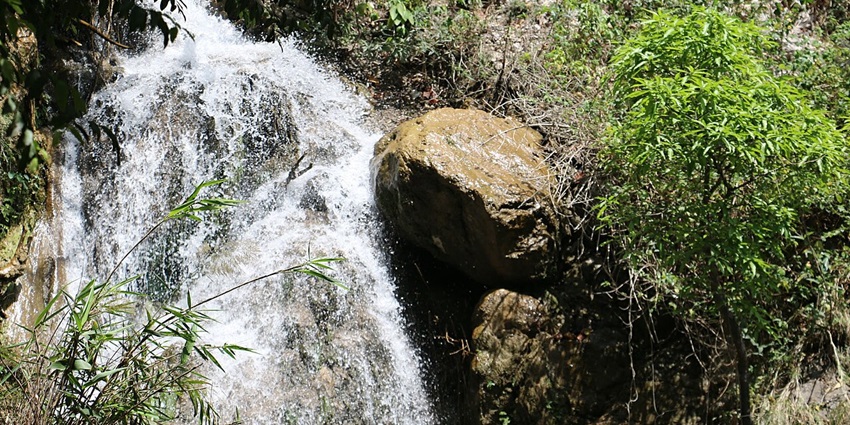 A hidden gem with cascading waters flowing through dense forests, perfect for trekking and relaxation.