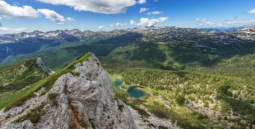 Picturesque view of serene Aamby Valley with mountains in the background under blue sky