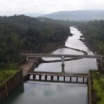 View of the Koyna Dam spillway and canal, showcasing stunning landscapes in Chiplun.