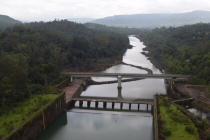 View of the Koyna Dam spillway and canal, showcasing stunning landscapes in Chiplun.