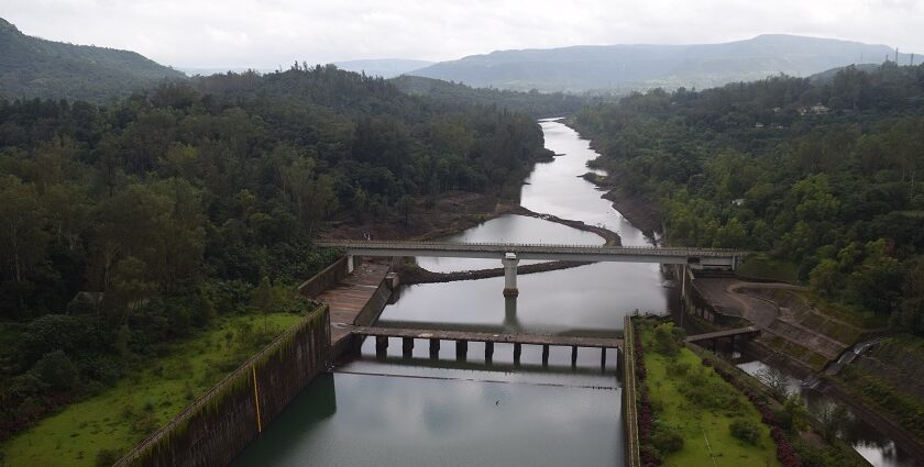 View of the Koyna Dam spillway and canal, showcasing stunning landscapes in Chiplun.