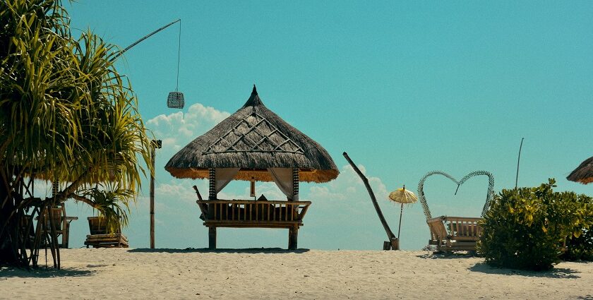 A cloudy weather picture with several shacks on the beach of Gili Trawangan island.