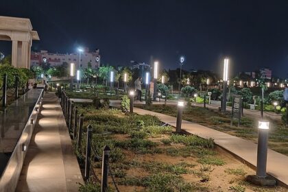 Nighttime in a Jaipur city park, where twinkling lights adorn trees, creating a tranquil and inviting outdoor space.