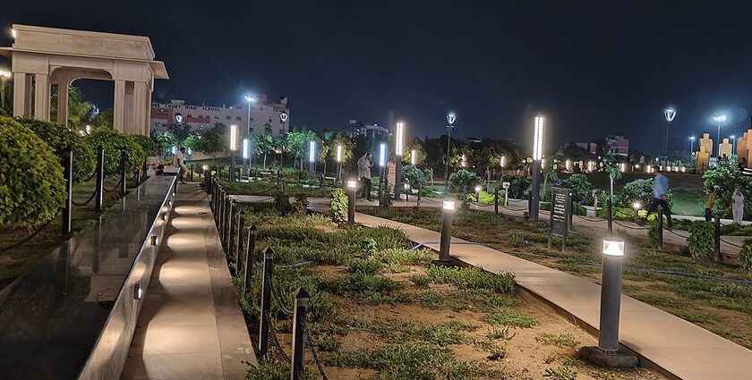 Nighttime in a Jaipur city park, where twinkling lights adorn trees, creating a tranquil and inviting outdoor space.