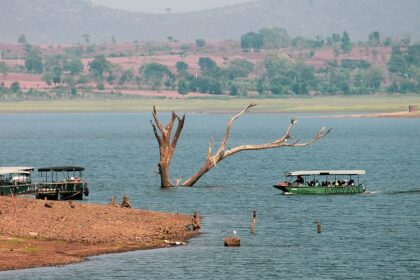 An astonishing view of shimmering blue waters of a lake decked with colourful boats.