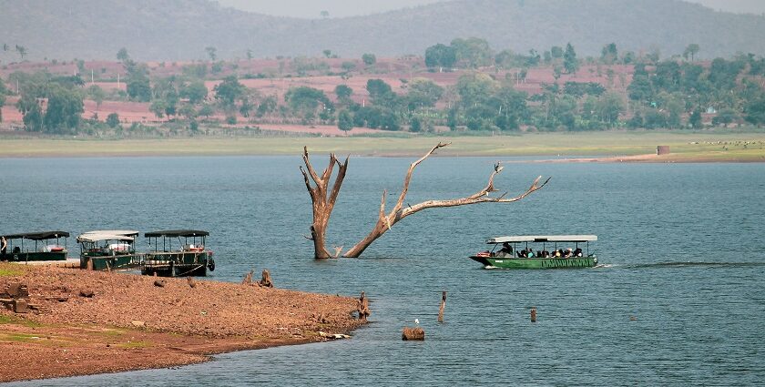 An astonishing view of shimmering blue waters of a lake decked with colourful boats.