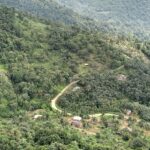 A scenic view of Madikeri village surrounded by green hills and mist–Things to do in Madikeri