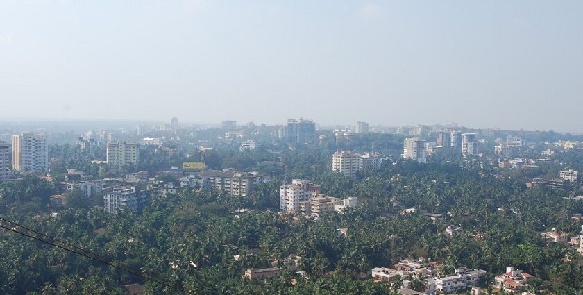 View of Mangalore skyline with vibrant sunset and urban architecture.