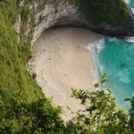 A bird’s eye view of a famous island featuring shimmering waters and pristine sands.