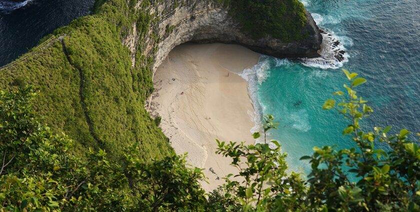 A bird’s eye view of a famous island featuring shimmering waters and pristine sands.