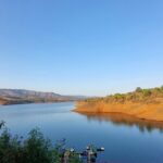 A wonderful view of Panshet Dam with calm waters and mountains in the background.