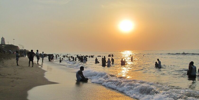 A picture of some tourists enjoying sunrise–one of the best things to do in Thiruchendur