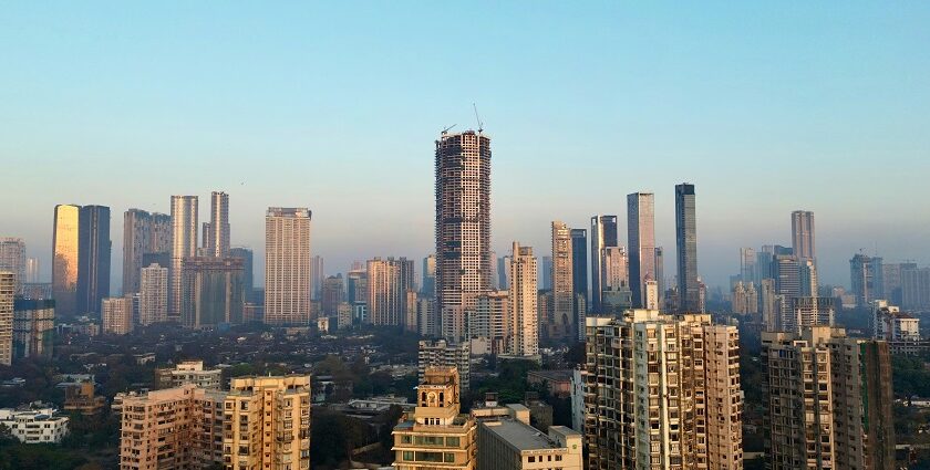 A view of the South Mumbai skyline, featuring skyscrapers and city lights.