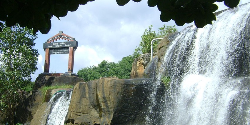 Stunning waterfall surrounded by lush greenery, perfect for nature lovers.
