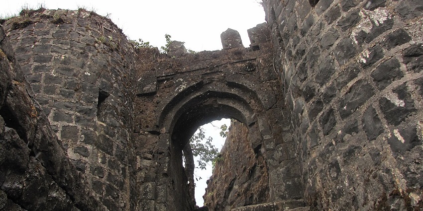 A view of Tikona Fort, showing a stone entrance, one of the famous places near Morgiri Fort.
