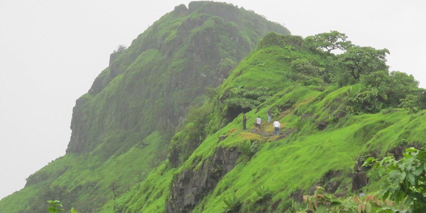 Tikona Fort is a triangular hill fort in Maharashtra, known for trekking and panoramic views.