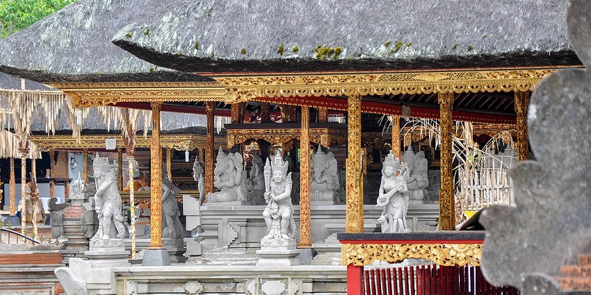 An image of pilgrims bathing in the spring waters at one of the holy temples in Bali.
