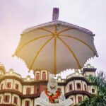 Rajwada Palace, one of the key places to visit in Indore featuring a decorative arch.