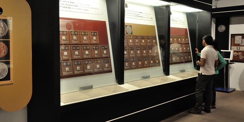 Gallery of the coin Museum featuring a shelf containing coins in display