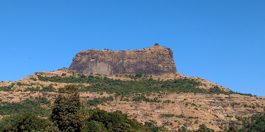 Distant view of the Harihar Fort, a trekking experience among the things to do in Nashik