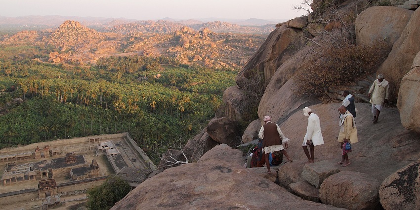 Hindu pilgrims are descending from Matanga Hill to reach Achyutaraya Temple before night time