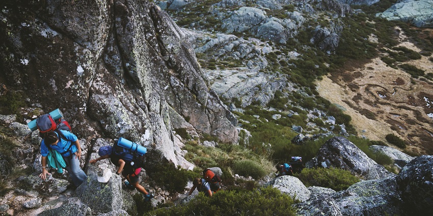 A glimpse of people trekking through the rustic terrains near the Mandangad Fort.