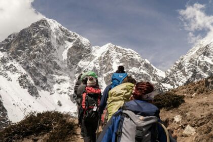 A glimpse of people walking through the rustic terrains soaking the beauty of natural.