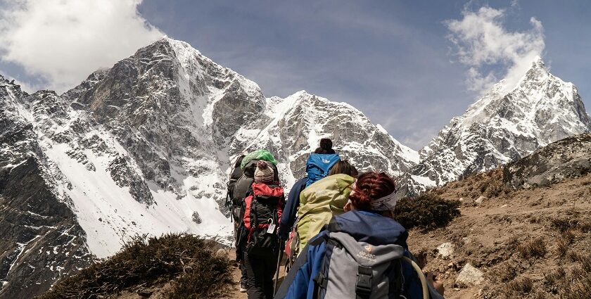 A glimpse of people walking through the rustic terrains soaking the beauty of natural.